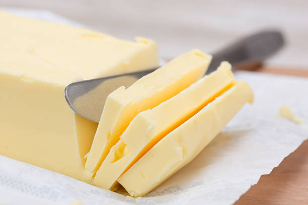 istock fresh butter in bar form and a knife 537243713