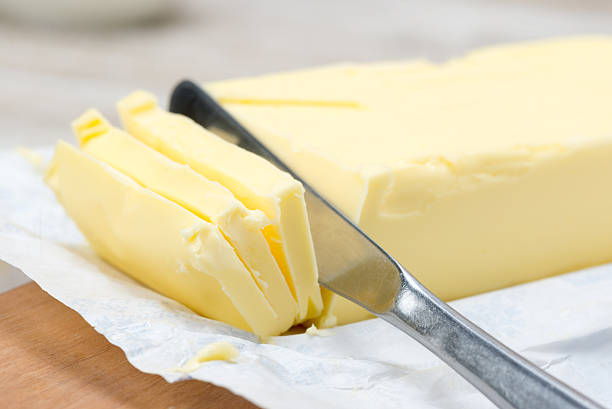 istock fresh butter in bar form and a knife 537243729