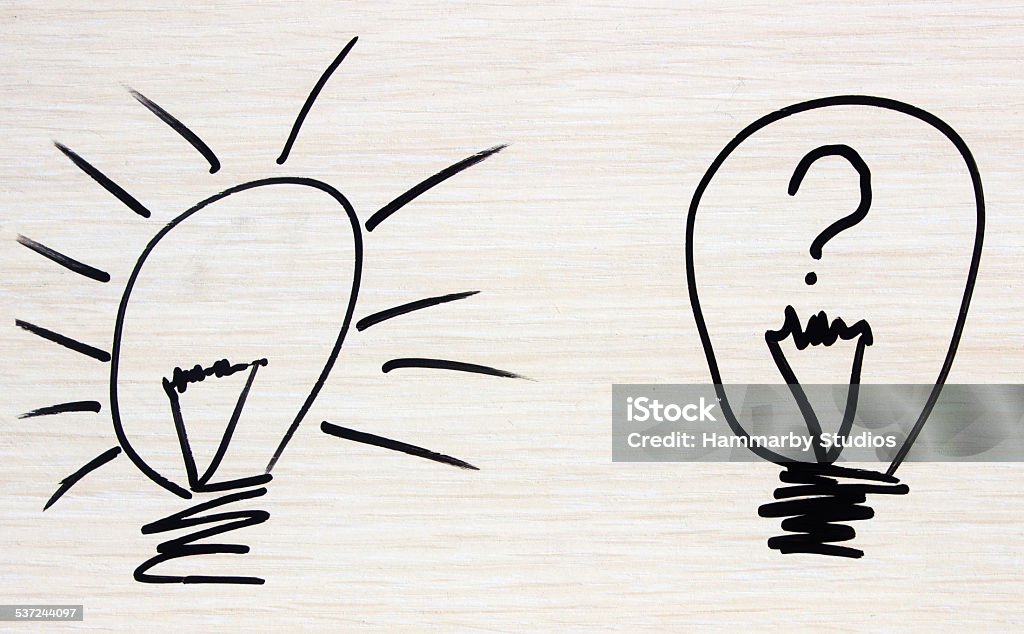 Problems There are two lamps. One of lamp is lighting. Another lamp is not lighting. And There is also a question mark on lamp that doesn't light. It's uninspiring.  2015 Stock Photo