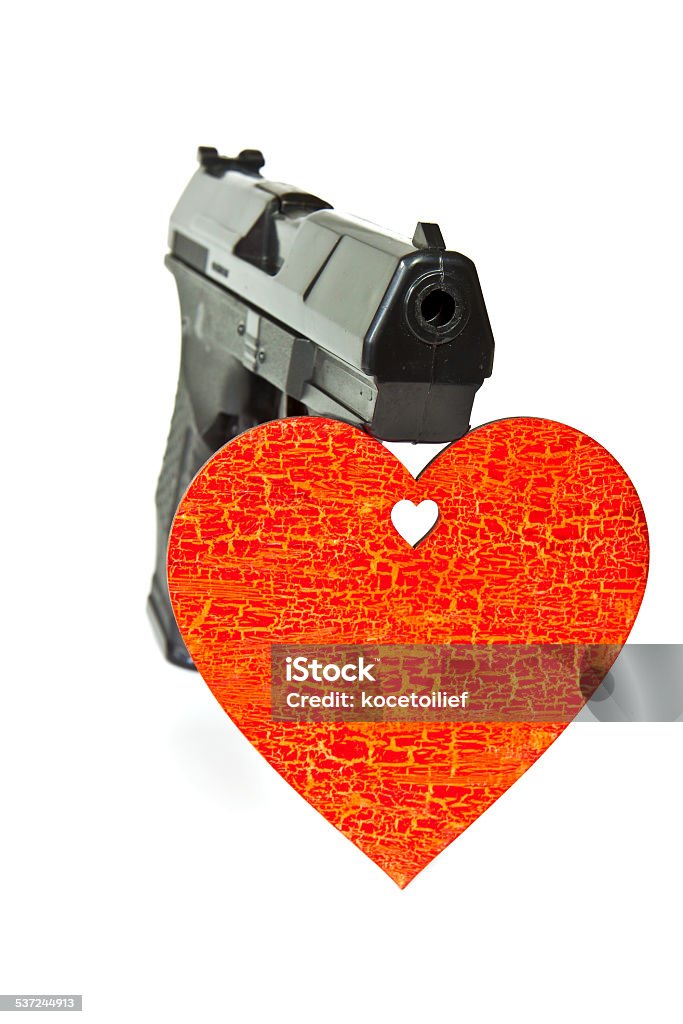 Air gun pistol Pneumatic air gun and painted red wooden heart 2015 Stock Photo