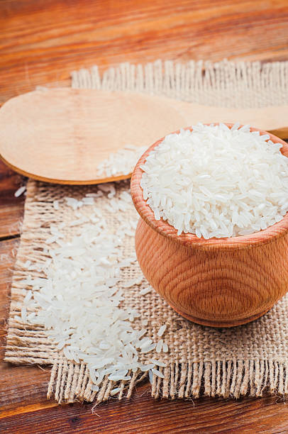 istock rice in a pot and spoon on burlap 537245227