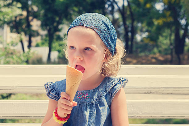 istock Funny little girl (3 years) eat ice cream. 537246802