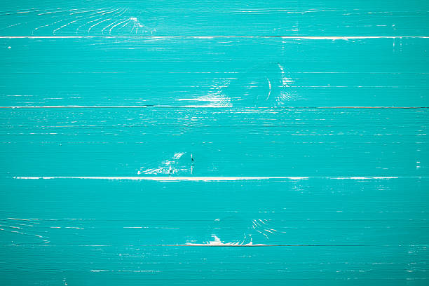 Turquoise Wood background Turquoise planks great as background. This file is cleaned and retouched. knotted wood wood dirty weathered stock pictures, royalty-free photos & images