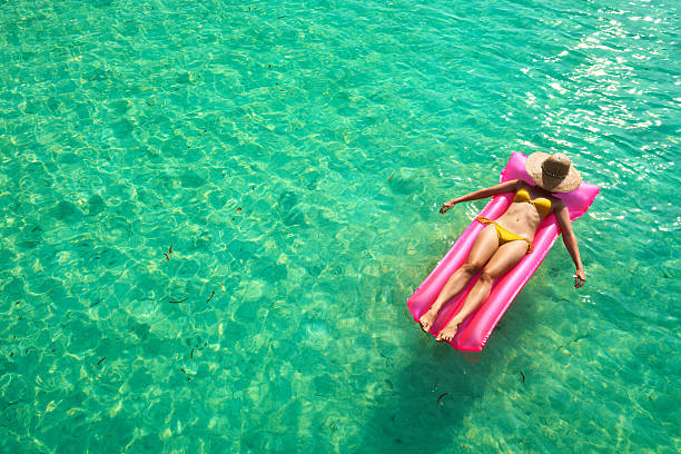 istock Woman relaxing on inflatable mattress 537247591