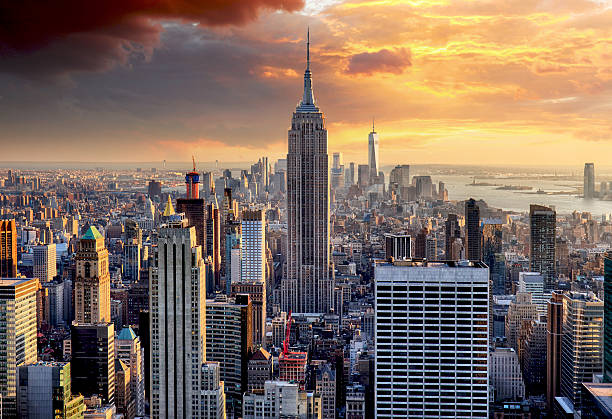 New York skyline at sunset, USA. New York skyline at sunset, USA. wall street lower manhattan stock pictures, royalty-free photos & images