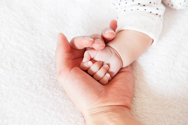 istock New born baby hand 537248056