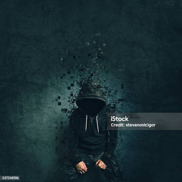 Spooky Evil Criminal Person With Hooded Jacket Dissolving Stock Photo - Download Image Now