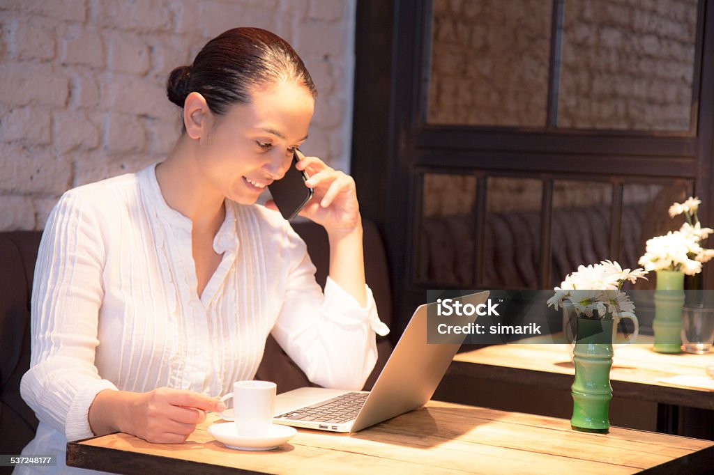 Woman with Laptop in Cafe Woman with laptop in cafe,horizontal 2015 Stock Photo