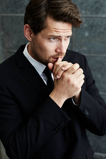 istock Pensive businessman in black, looking away 537249132
