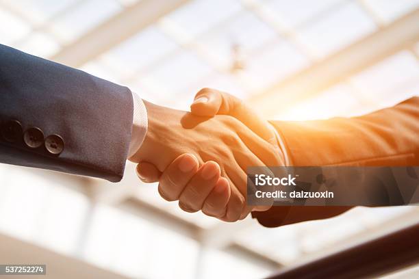 Handshaking Stock Photo - Download Image Now - Handshake, Business, Agreement