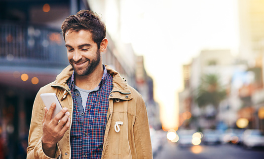 Cropped shot of a young man commuting through the city