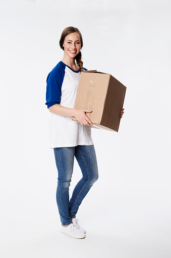 Beautiful woman with cardboard box, smiling