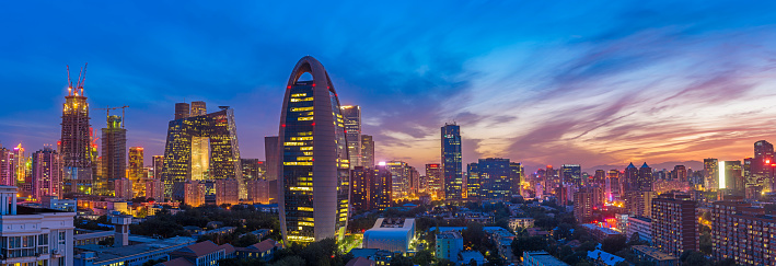 Aerial view of city skyline and modern buildings in Suzhou at sunset, Jiangsu Province, China.