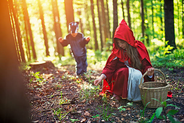istock Big Bad Wold sneaking on Little Red Riding Hood 537256660