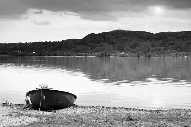 istock Abandoned paddle boat on bank. Morning Alps lake 537258886