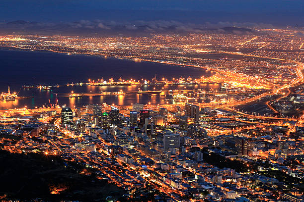 Cape Town city lights Lion's head night South Africa Cape Town city lights from the Lion's head parking lot at dusk below the foothills of Table Mountain, South Africa.  malay quarter photos stock pictures, royalty-free photos & images