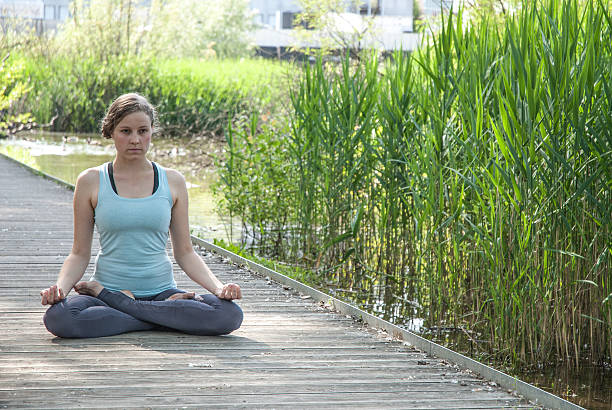 istock Young woman in yoga pose 537261256
