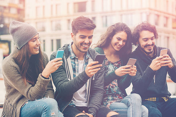 istock Group of young people with smart phones 537261536