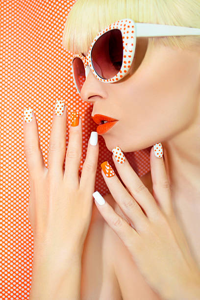 Sunny orange manicure and makeup.