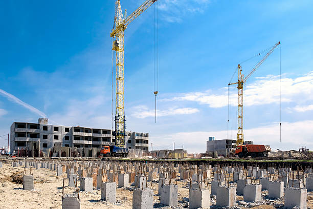istock Construction cranes on a background of blue sky 537268902