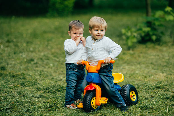 istock Childrens play and ride a bicycle outdoors 537269762