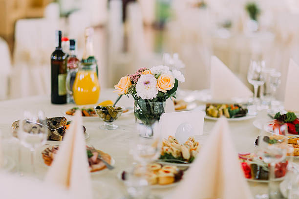 istock Finely served banquet restaurant table with snacks, cutlery, wine, glasses 537271968