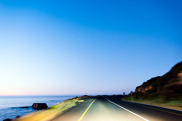 istock Motor Vehicle Driving On The Road At Night 537272078