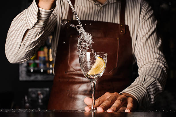 istock splash in a glass with lemon barman on background 537272098