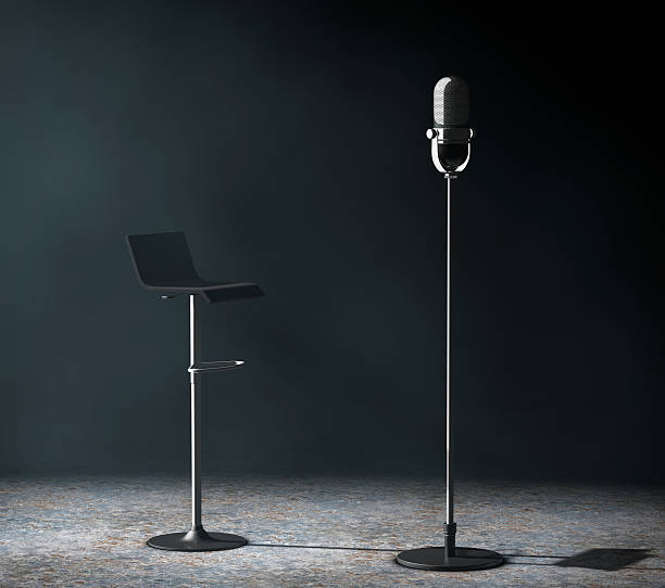 istock Vintage silver microphone with Chair in the volumetric light. 3d 537272484