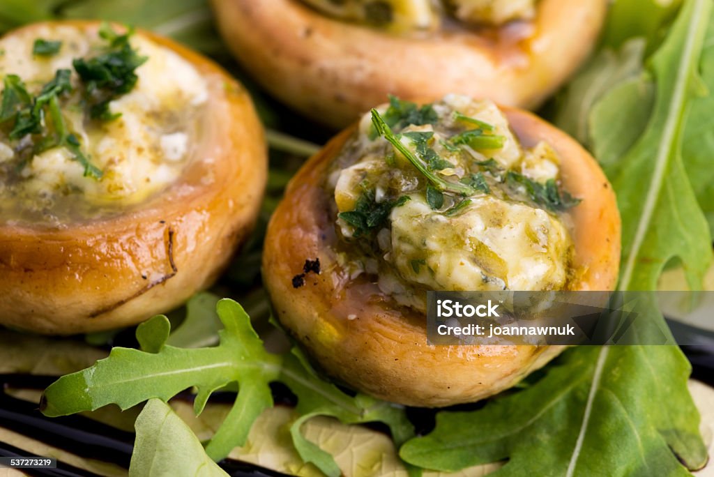 Delicious stuffed mushrooms with cheese and pesto 2015 Stock Photo