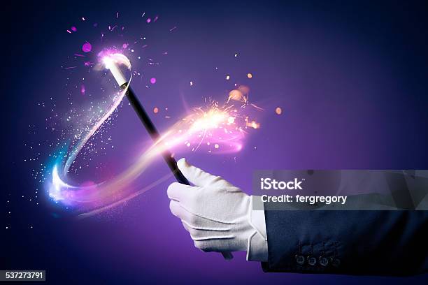 High Contrast Image Of Magician Hand With Magic Wand Stock Photo - Download Image Now