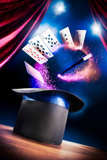 High contrast image of magician hat on a stage photo composite of a magic hat on a stage magic trick photos stock pictures, royalty-free photos & images