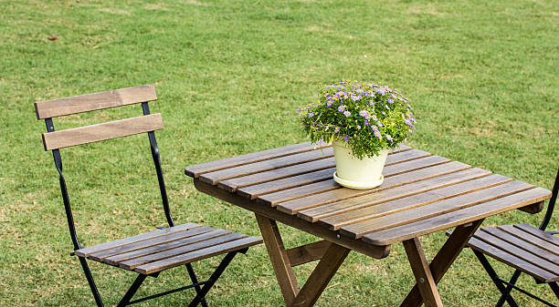 istock small beautiful flowers pots decoration on wooden table 537274725
