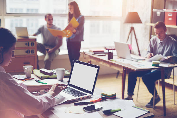 Team working in big loft office stock photo