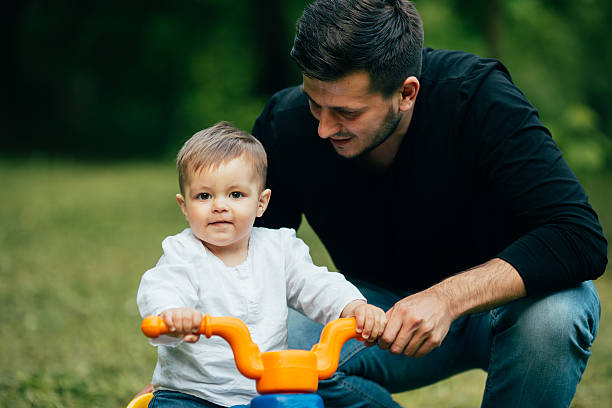 istock Portrait of father and son teaching to ride 537281928