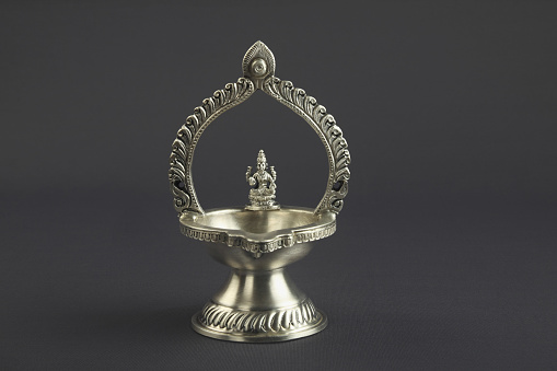     Indian Traditional Oil Lamp Isolated on Gray