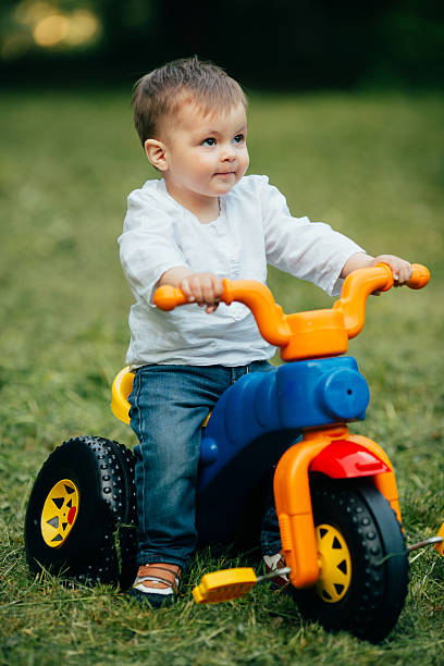 istock Small kid ride a bicycle outdoors 537282736