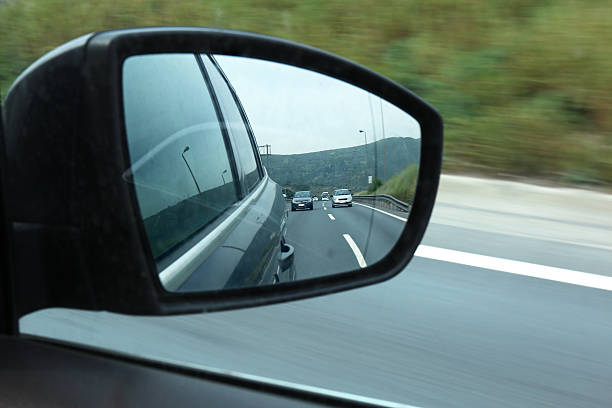 istock Road traffic captured in car mirror 537282880