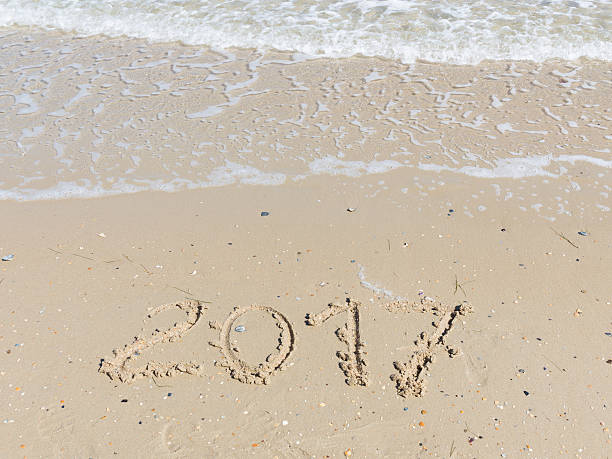 2017 inscription on the yellow sand