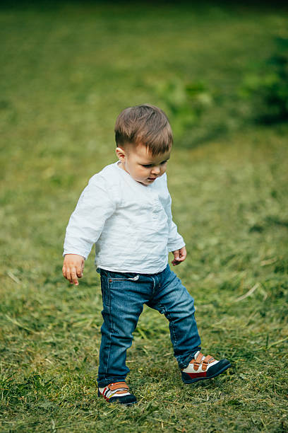 istock Small little boy walking and play outdoors in park 537283724