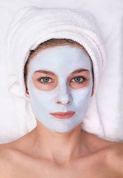 istock Young woman with facial mask 537283894