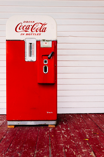 Memphis, United States of America - August 12, 2013: A red vintage coca cola vending machine