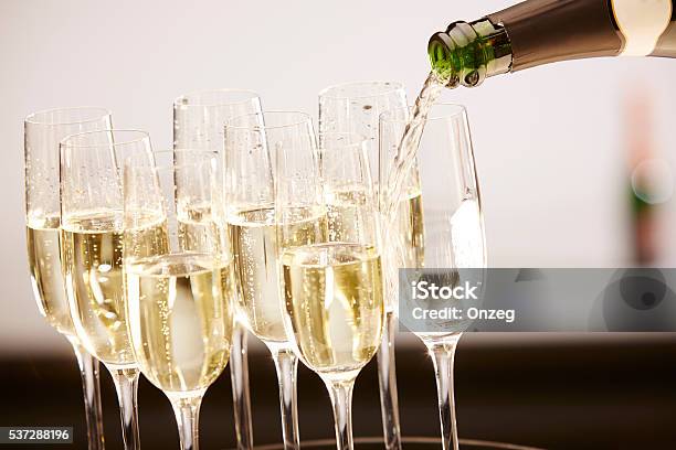 Glasses Full Of Champagne On A Tray Stock Photo - Download Image Now - Champagne, Champagne Region, Champagne Flute