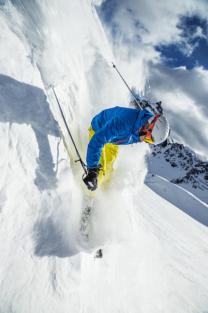 istock Skier skiing downhill in high mountains 537288639