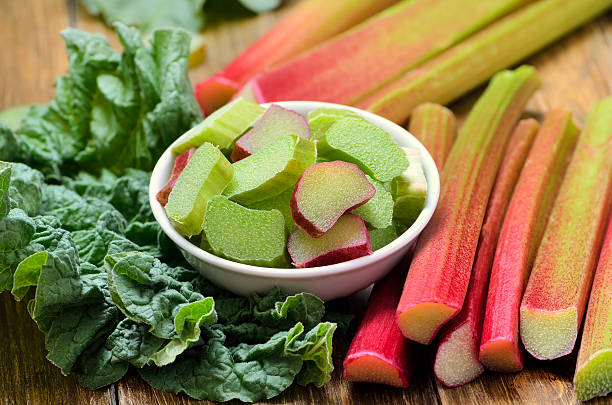 istock Fresh rhubarb in white bowl on wooden table 537288926