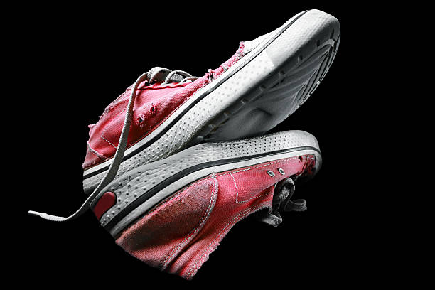 istock Canvas shoes on a black background. 537289635
