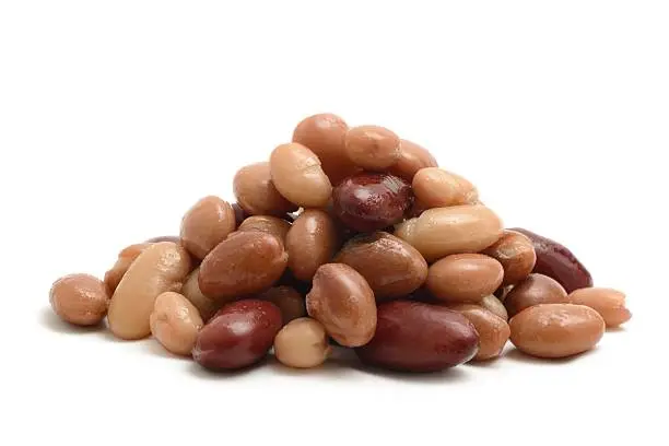 Kidney beans, pinto beans, cannellini beans, borlotti beans and haricot beans isolated on a white background.