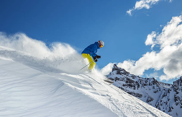 istock Skier skiing downhill in high mountains 537290753