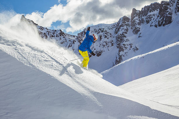 istock Skier skiing downhill in high mountains 537290755