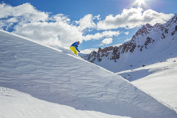 istock Skier skiing downhill in high mountains 537290757